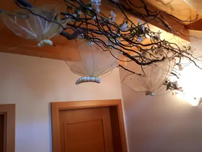 two umbrellas hanging from the ceiling of a room at Ferienwohnungen Hofanger in Lagundo
