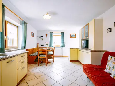a church on a hill with mountains in the background at Apartment Delago by Interhome in Pera
