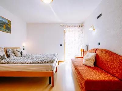 a bathroom with a shower with a toilet at Apartment Delago by Interhome in Pera