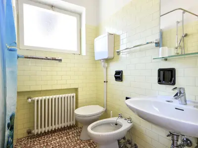 a bathroom with a toilet and a sink at Apartment El Ladinia-2 by Interhome in Moena