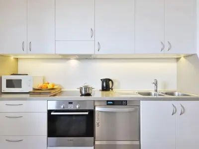 a kitchen with a table with a bowl of fruit on it at Holiday Home Kostner-2 by Interhome in Bulla