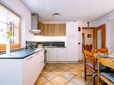a wooden balcony with a view of a mountain at Holiday Home Punta Emma by Interhome in Pera