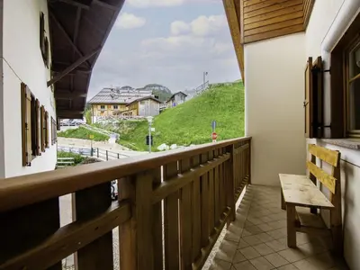 a church on a hill with mountains in the background at Holiday Home Punta Emma by Interhome in Pera
