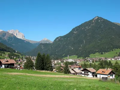 a village in a valley with mountains in the background at Holiday Home Punta Emma by Interhome in Pera