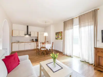 a living room with a couch and a table at Apartment Lichtenberg by Interhome in Postal