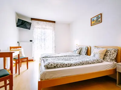 a bedroom with a bed and a window at Apartment Stabler by Interhome in Pera