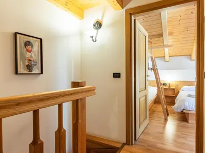 a room with a staircase leading to a bedroom at Apartment Cesa degli Abeti by Interhome in Campitello di Fassa