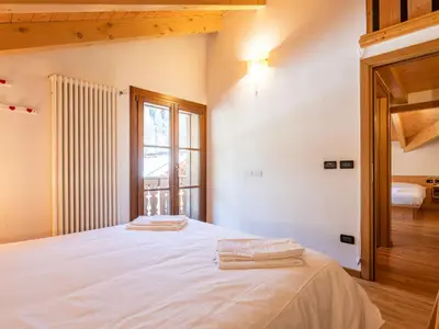 a bedroom with a bunk bed and a ladder at Apartment Cesa degli Abeti by Interhome in Campitello di Fassa