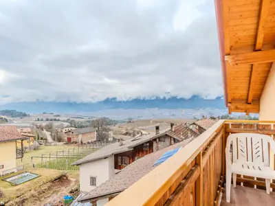 a balcony with chairs and a view of the countryside at Apartment Vento Alpino-2 by Interhome in Predaia