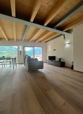 a living room with a couch and a table at VILLA IRIS 6 persone in Transacqua