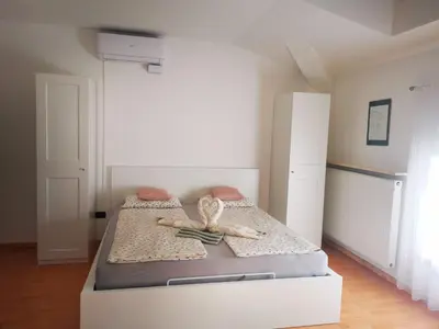 a bedroom with a bed with a bow on it at Apartment Anna in Merano