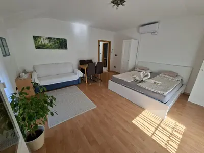 a living room with a bed and a couch at Apartment Anna in Merano
