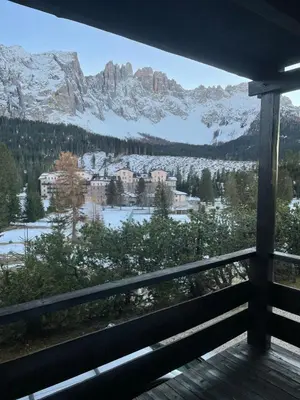 a view of a mountain from the balcony of a house at CIASA LAURINA - Apartment near the slopes with Dolomite views in Carezza al Lago