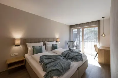 a bedroom with a bed with a blanket on it at Residence Sonja in Rablà