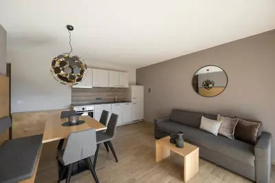 a living room with a couch and a table at Residence Sonja in Rablà