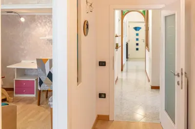 a hallway with a door leading into a room at All'Uno, Taio Ospitar in Taio