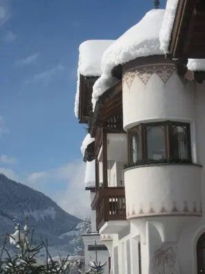 a building with snow on the side of it at Apartment Manuel in Ortisei