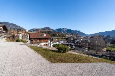 a view of a town with mountains in the background at Appartamento Vittoria in Cavalese
