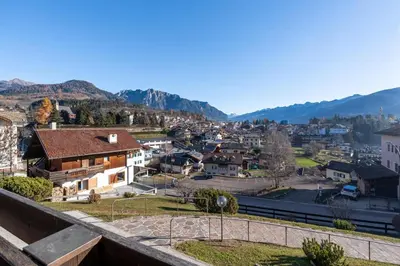 a view of a town with mountains in the background at Appartamento Vittoria in Cavalese