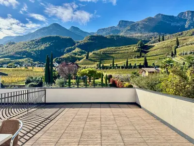 a balcony with a view of the mountains at Kalterer See Hof in Caldaro