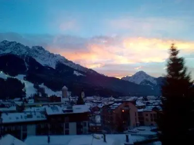a view of a city with snow covered mountains at Luxury panoramic apartment Plan de Corones in Tesido