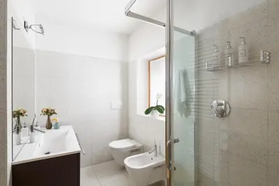 a bathroom with a sink and a toilet and a shower at VILLA MARGHERITA - 5 minutes from Dolomiti Super Ski in Ziano di Fiemme