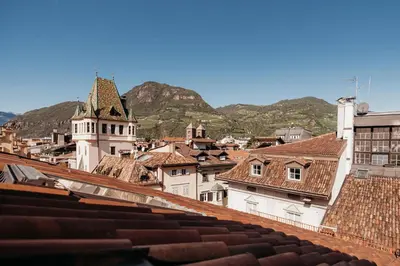 a view of a city with mountains in the background at Loft Thaler Rooms in Bolzano