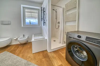 a washing machine in a bathroom with a sink at HOMESTWENTY3 - Home three in Caldaro