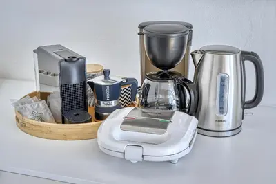 a counter with a blender and other appliances on it at HOMESTWENTY3 - Home three in Caldaro