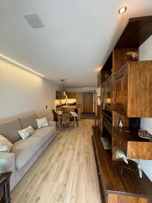 a living room with a couch and a table at Renesmee Apartment in Naturno