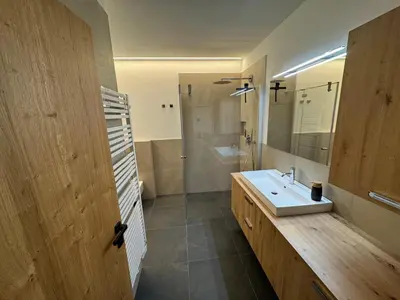 a bathroom with a sink and a shower at Renesmee Apartment in Naturno