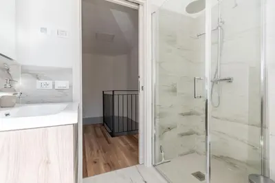 a bathroom with a shower and a sink at Casa Adriana in Agordo