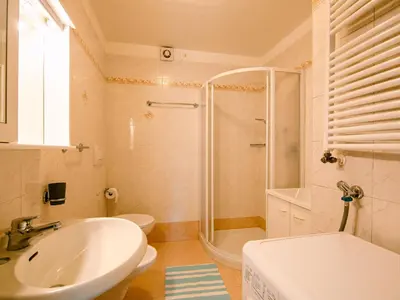 a bathroom with a sink and a toilet at Apartment Ciampedie by Interhome in Pera