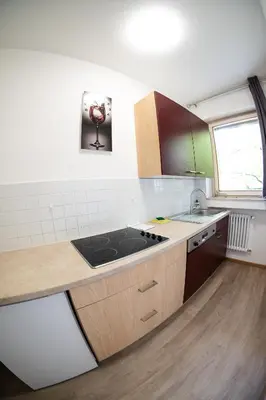 a kitchen with a sink and a counter top at Flow Apartments KIRCHSTEIG in Merano
