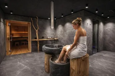 a bedroom with two white beds in a attic at ALPINE LOFT - Residence Veronza con piscina, Dolomiti Affitti in Cavalese
