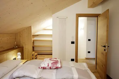 a wooden heart with a lock and a ladybug on it at ALPINE LOFT - Residence Veronza con piscina, Dolomiti Affitti in Cavalese