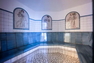 a swimming pool in a bathroom with two mirrors at Luxury Spa Suite in Siusi