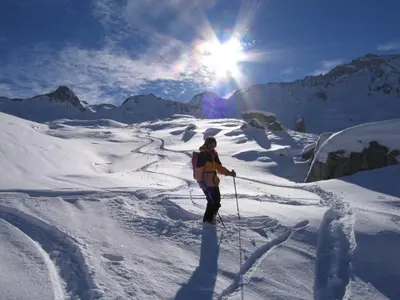 a person on skis in the snow on a mountain at Hotel Larchhof Ratschings in Racines