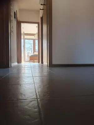 an empty hallway with an open door to a room at Plose Appartements in Bressanone