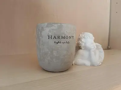 a vase sitting on a table next to a statue at Plose Appartements in Bressanone