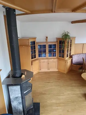 a living room with a wood stove in it at Plose Appartements in Bressanone