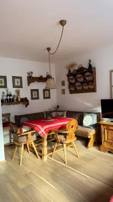 a living room with a table and a couch at La Sibilla in Riscone