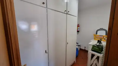 a group of white cabinets in a kitchen at Anto in Campitello di Fassa