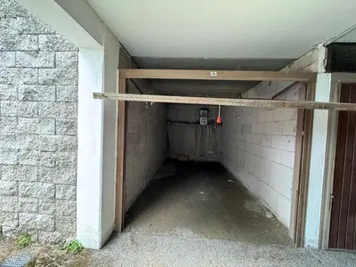 an empty tunnel with a door in a brick wall at Il Moro di Cavalese in Castello di Fiemme