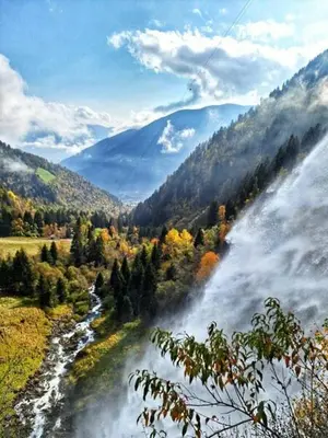 a view of a river in a valley with trees at Cafe Rudi Living Apartements in Parcines