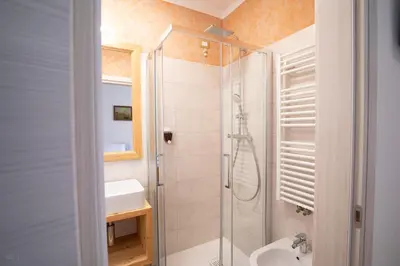 a bathroom with a shower and a sink at Residence Panorama in Val di Zoldo