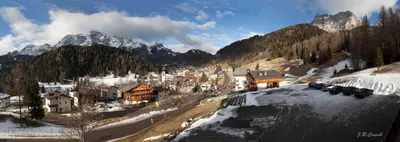 a town in the mountains with snow on the ground at Residence Panorama in Val di Zoldo