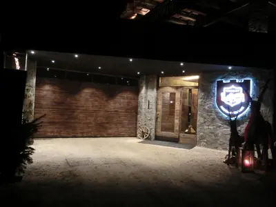 a room with a brick wall with a sign on it at Chalet Stefan - Apartments in La Villa