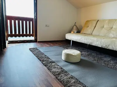 a living room with a couch and a rug at Bergchalet Platzl in Verano