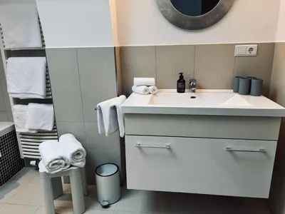a bathroom with a white sink and a mirror at Bergchalet Platzl in Verano
